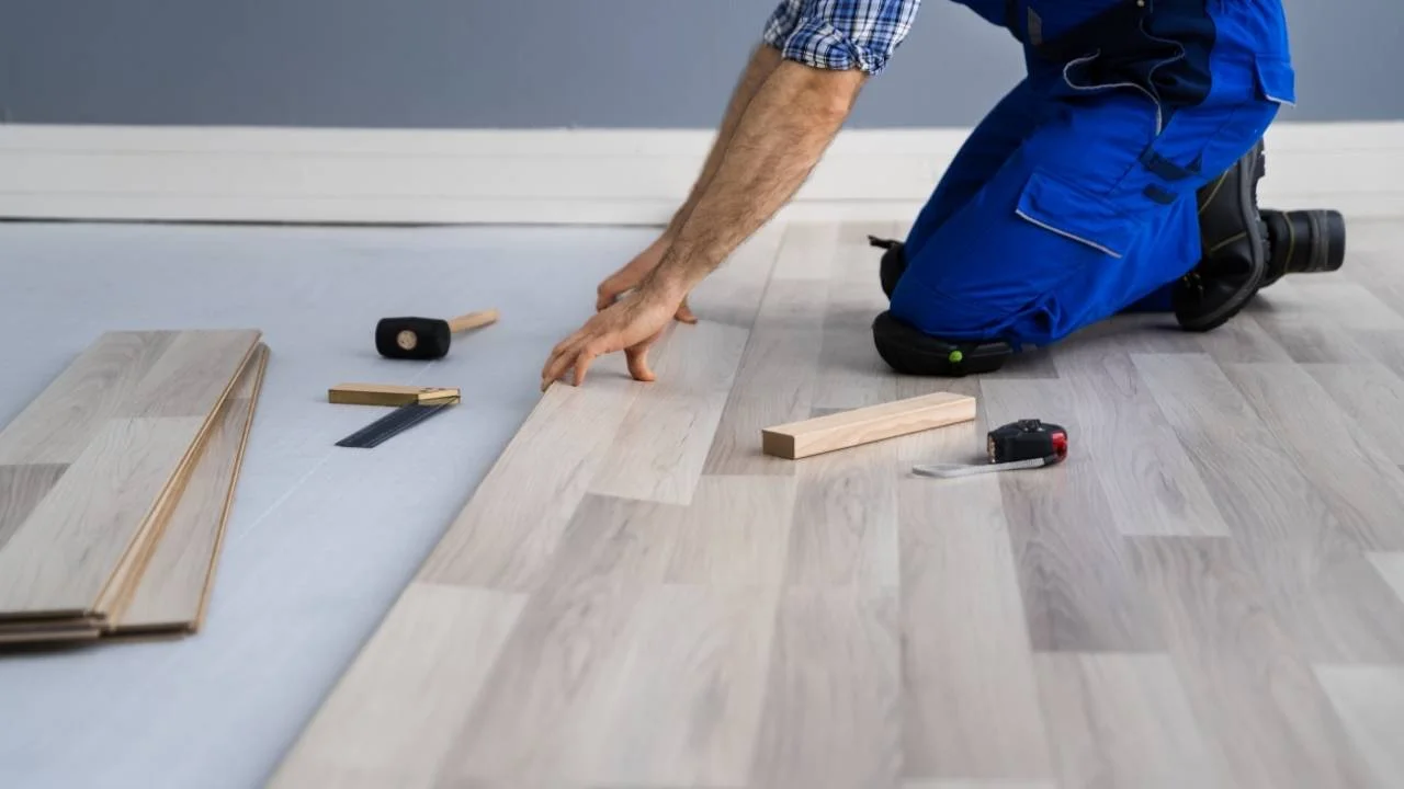 Professional installing beautiful hardwood floors in Ottawa home