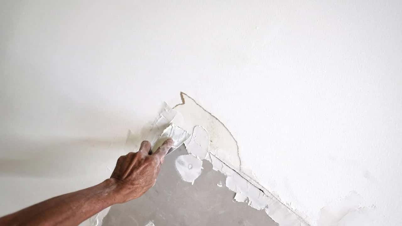 Professional drywall repair in Ottawa home - fixing holes and cracks